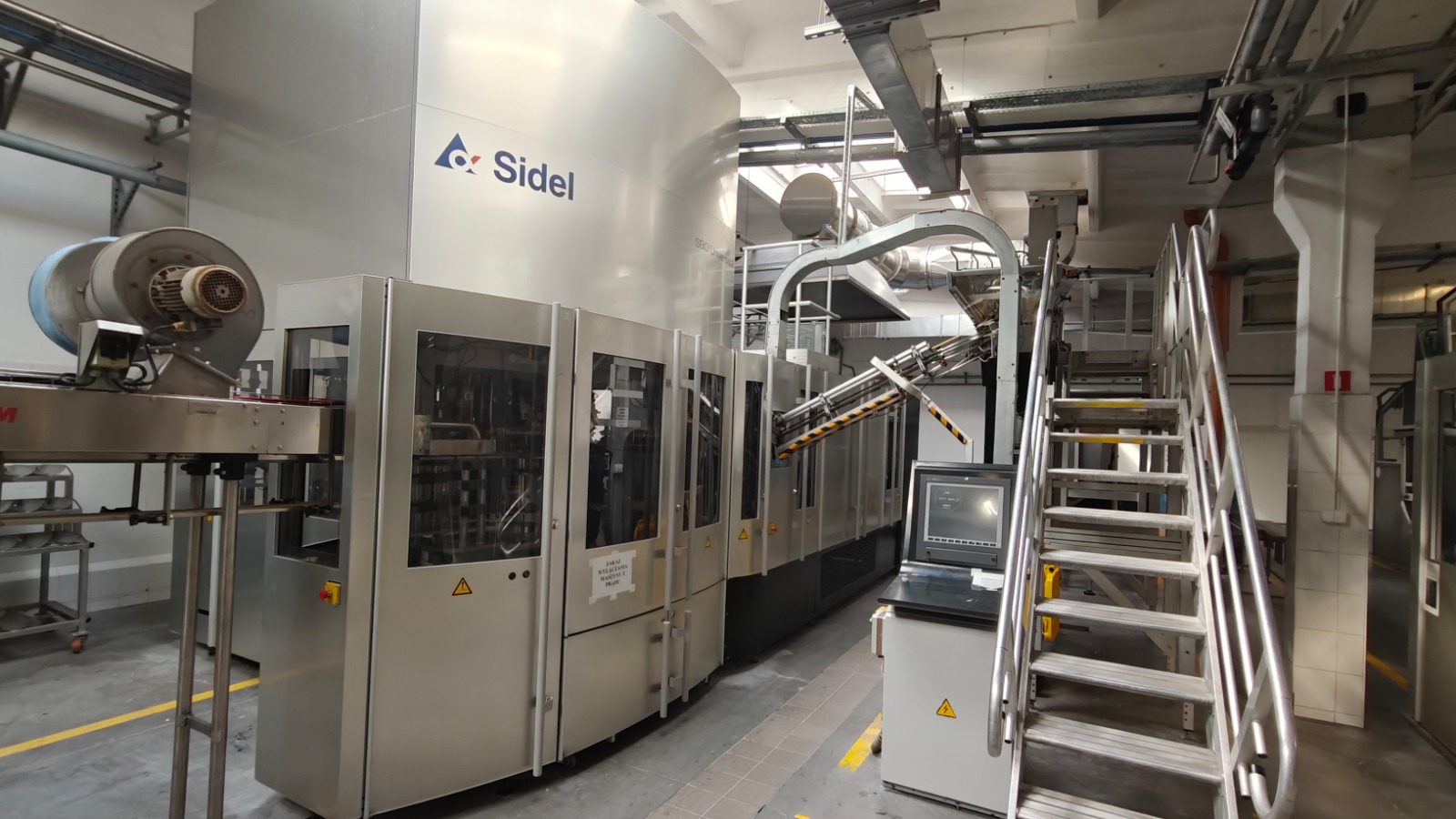 Ligne de remplissage de bouteilles PET non consignées SIDEL Alsim, Krones, SMI