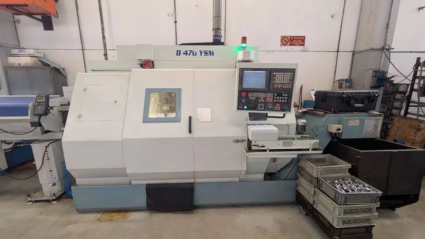 Tour CNC avec ravitailleur de barres Biglia B470 d'occasion